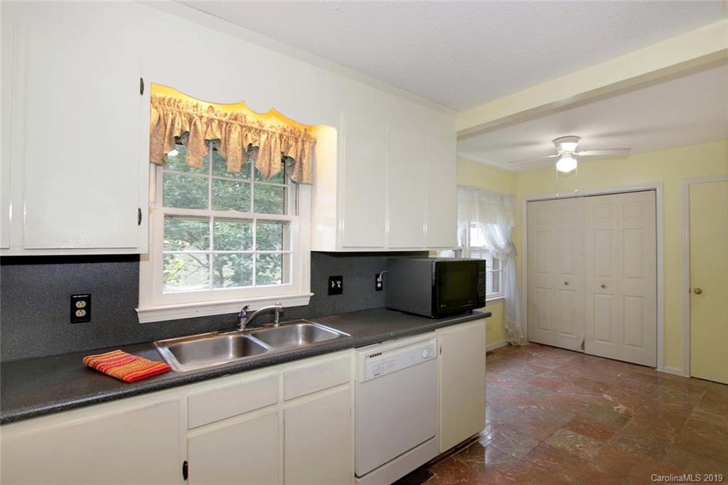 206 Sycamore Road Salisbury, NC 28147 - Photo 16 of 41 a kitchen with stainless steel appliances granite countertop a sink and a granite counter tops with a large window