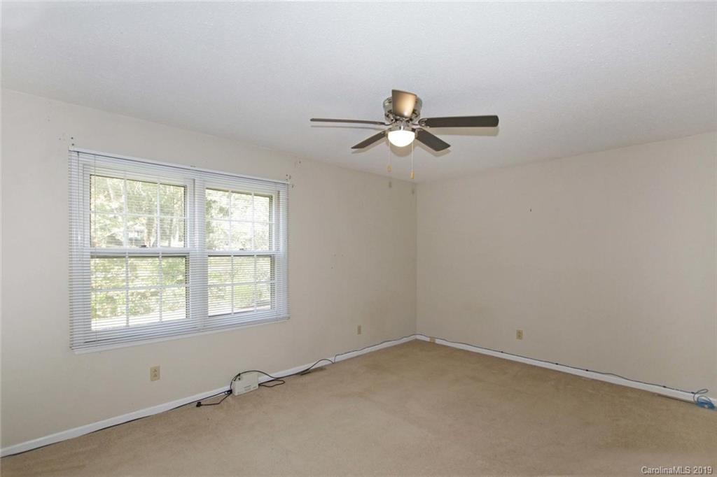 206 Sycamore Road Salisbury, NC 28147 - Photo 25 of 41 an empty room with a window and a fan