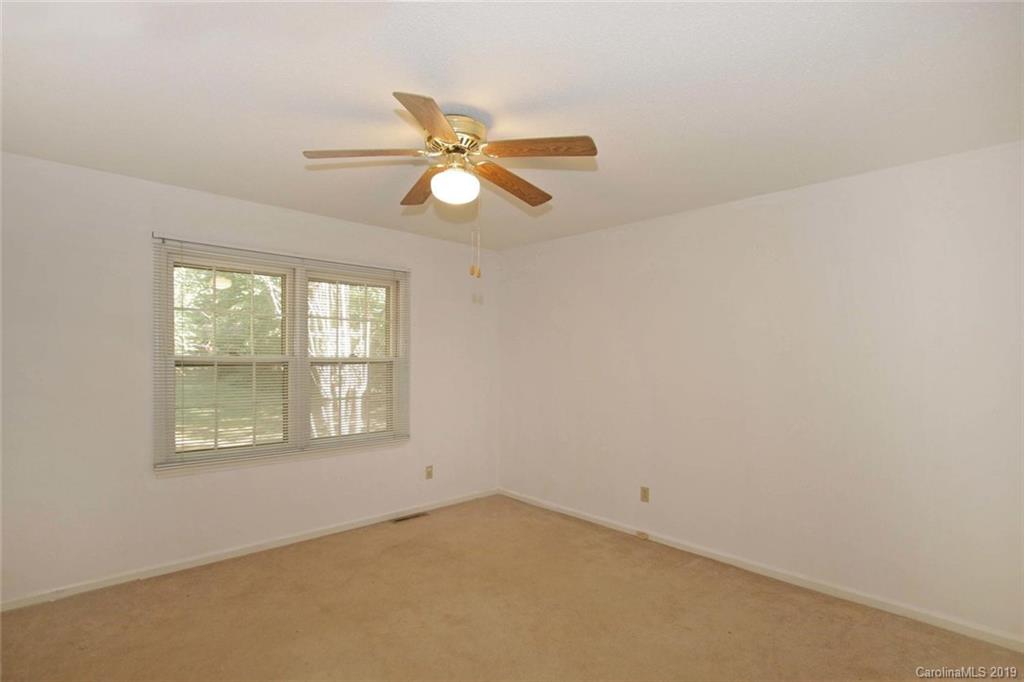 206 Sycamore Road Salisbury, NC 28147 - Photo 28 of 41 an empty room with a window and a fan