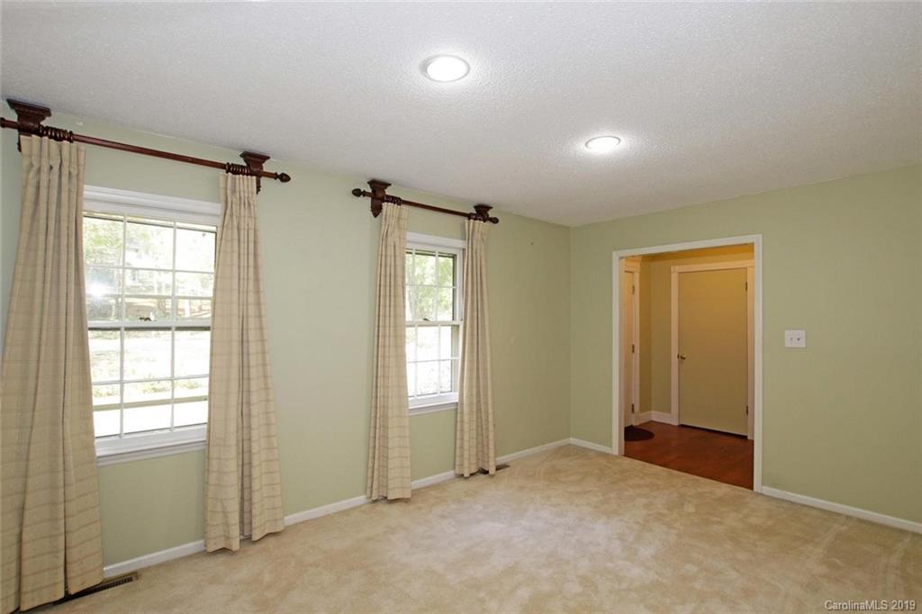 206 Sycamore Road Salisbury, NC 28147 - Photo 7 of 41 an empty room with windows