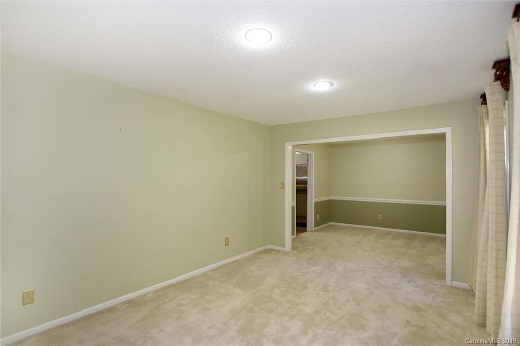 206 Sycamore Road Salisbury, NC 28147 - Photo 8 of 41 an empty room with an entryway