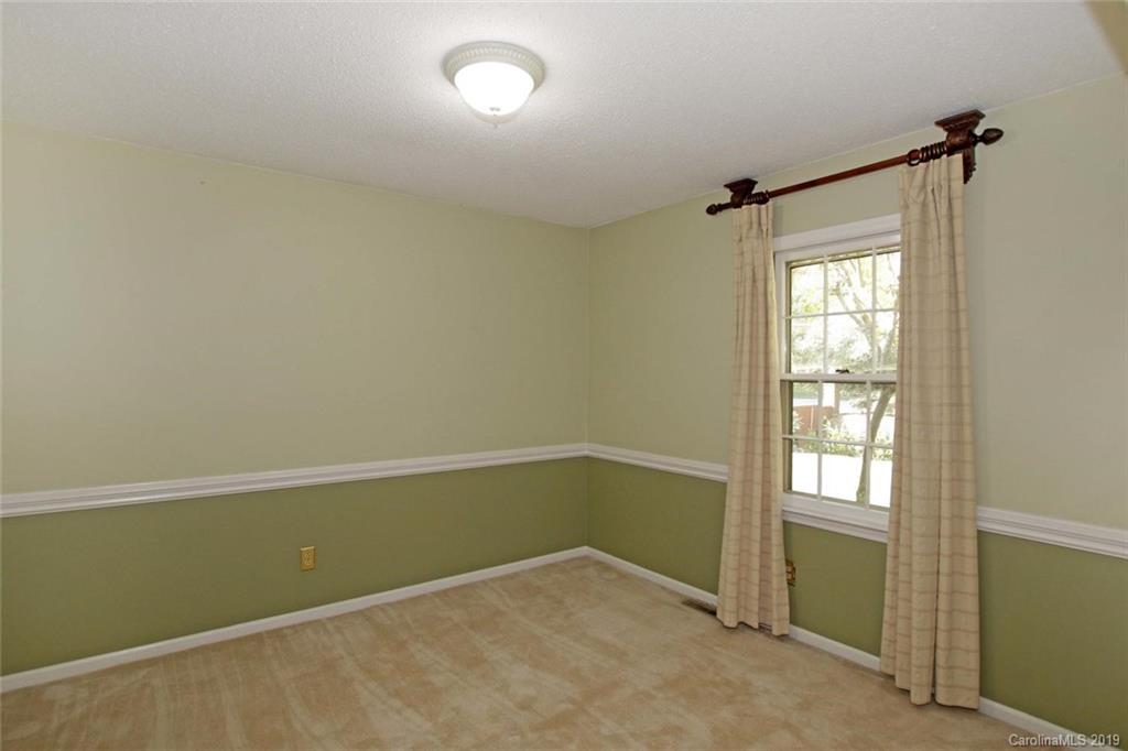 206 Sycamore Road Salisbury, NC 28147 - Photo 9 of 41 an empty room with windows