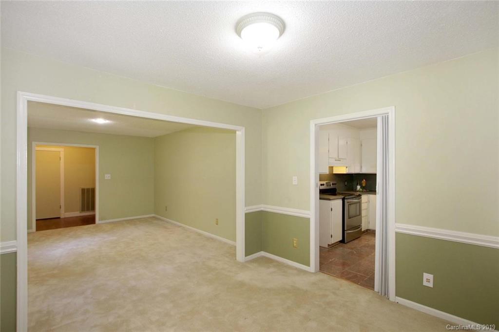 206 Sycamore Road Salisbury, NC 28147 - Photo 10 of 41 an empty room with cabinet and mirrors