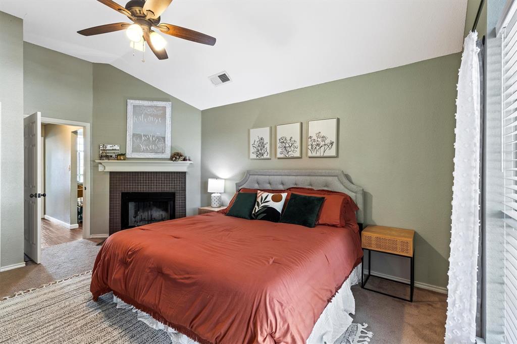 800 Short Line Boulevard Midlothian, TX 76065 - Photo 19 of 39 a spacious bedroom with a bed and a chandelier