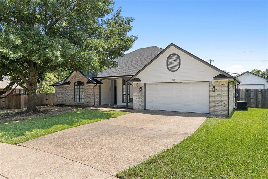 800 Short Line Boulevard Midlothian, TX 76065 - Photo 2 of 39 a front view of a house with a yard and garage