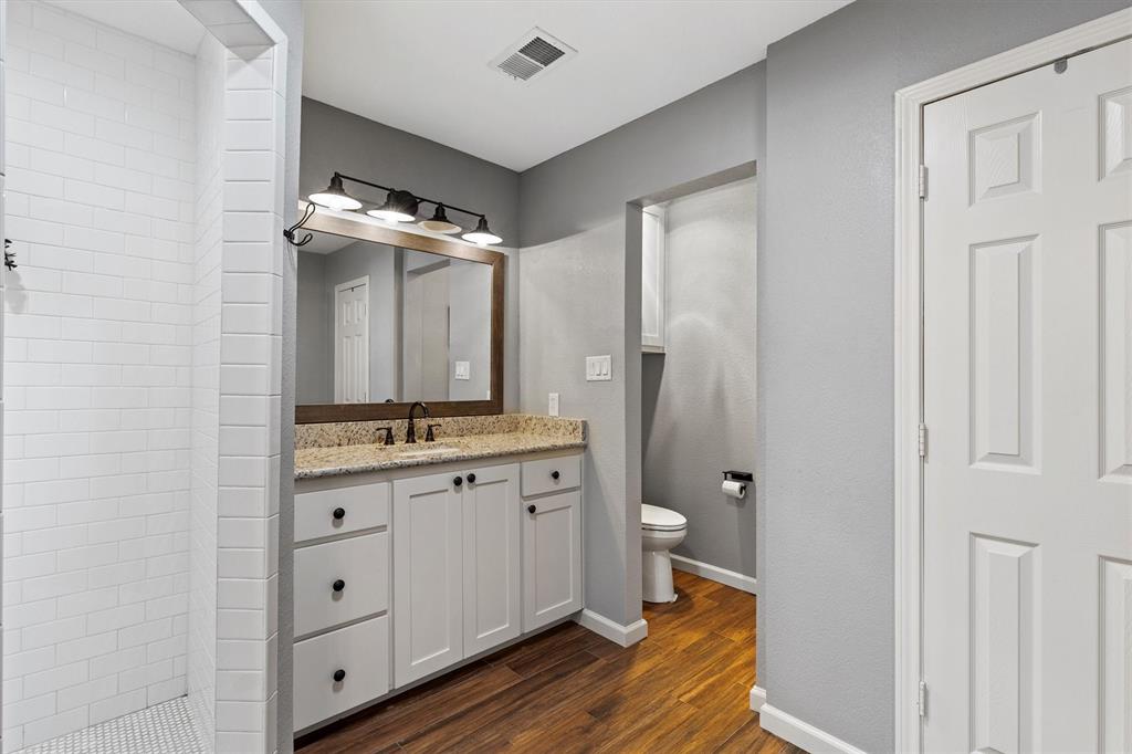 800 Short Line Boulevard Midlothian, TX 76065 - Photo 25 of 39 a bathroom with a double vanity sink toilet and mirror