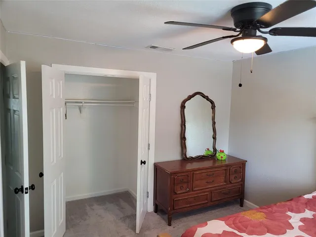 a room with a bed and a chandelier