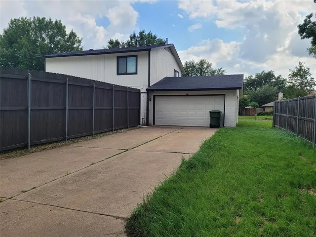 a front view of a house with a garage
