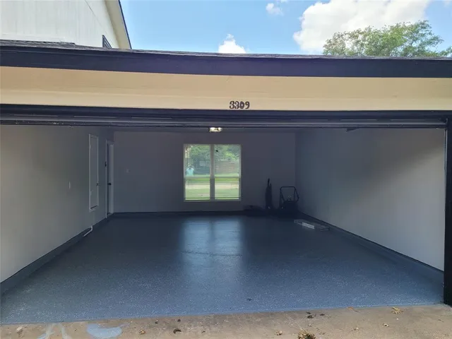 a view of a room with a window and a fireplace