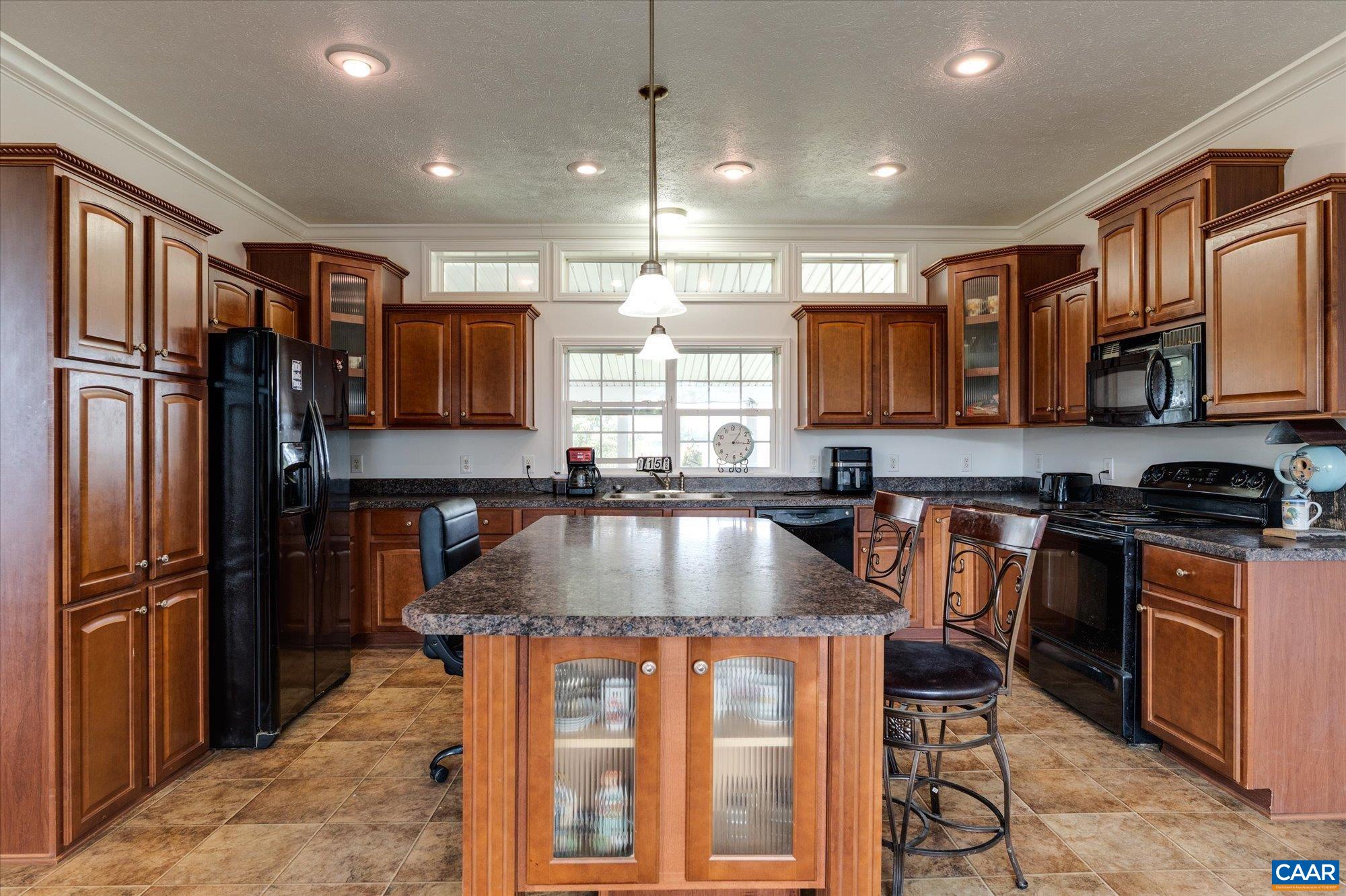 3225 Lynn Hollow Road North Tazewell, VA 24630 - Photo 30 of 62 a kitchen with stainless steel appliances granite countertop a refrigerator a stove top oven a sink and dishwasher