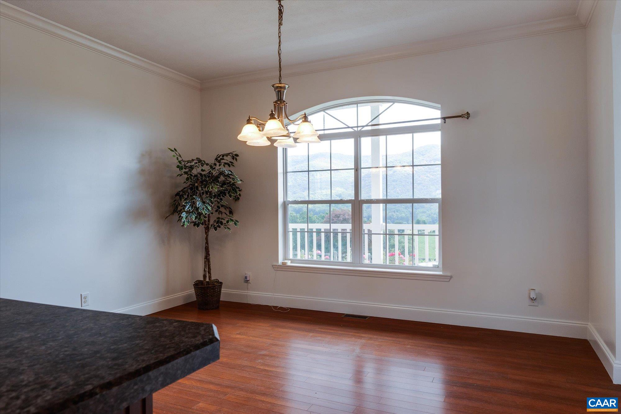 3225 Lynn Hollow Road North Tazewell, VA 24630 - Photo 33 of 62 a view of an empty room with wooden floor and a window