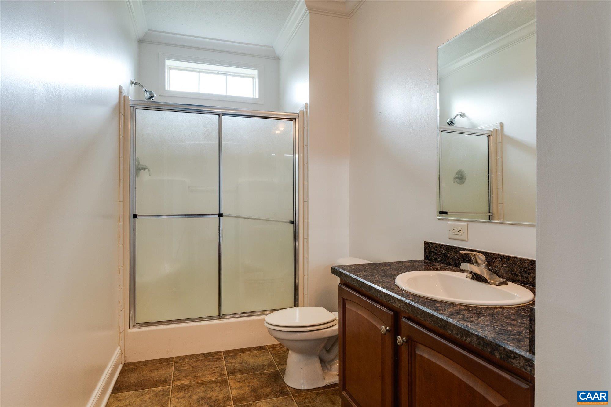 3225 Lynn Hollow Road North Tazewell, VA 24630 - Photo 35 of 62 a bathroom with a granite countertop sink toilet mirror and shower