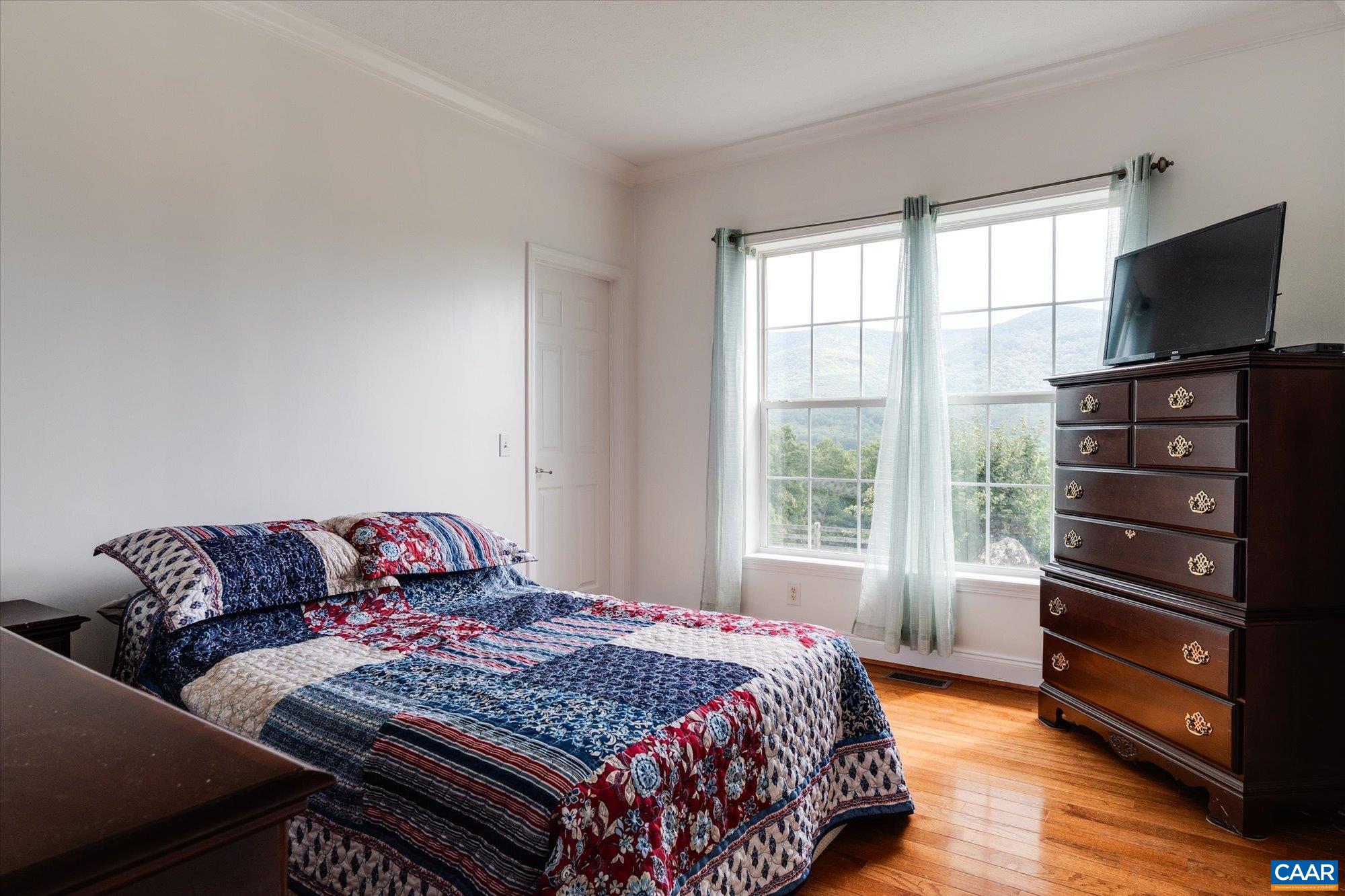 3225 Lynn Hollow Road North Tazewell, VA 24630 - Photo 36 of 62 a bedroom with a bed and a television