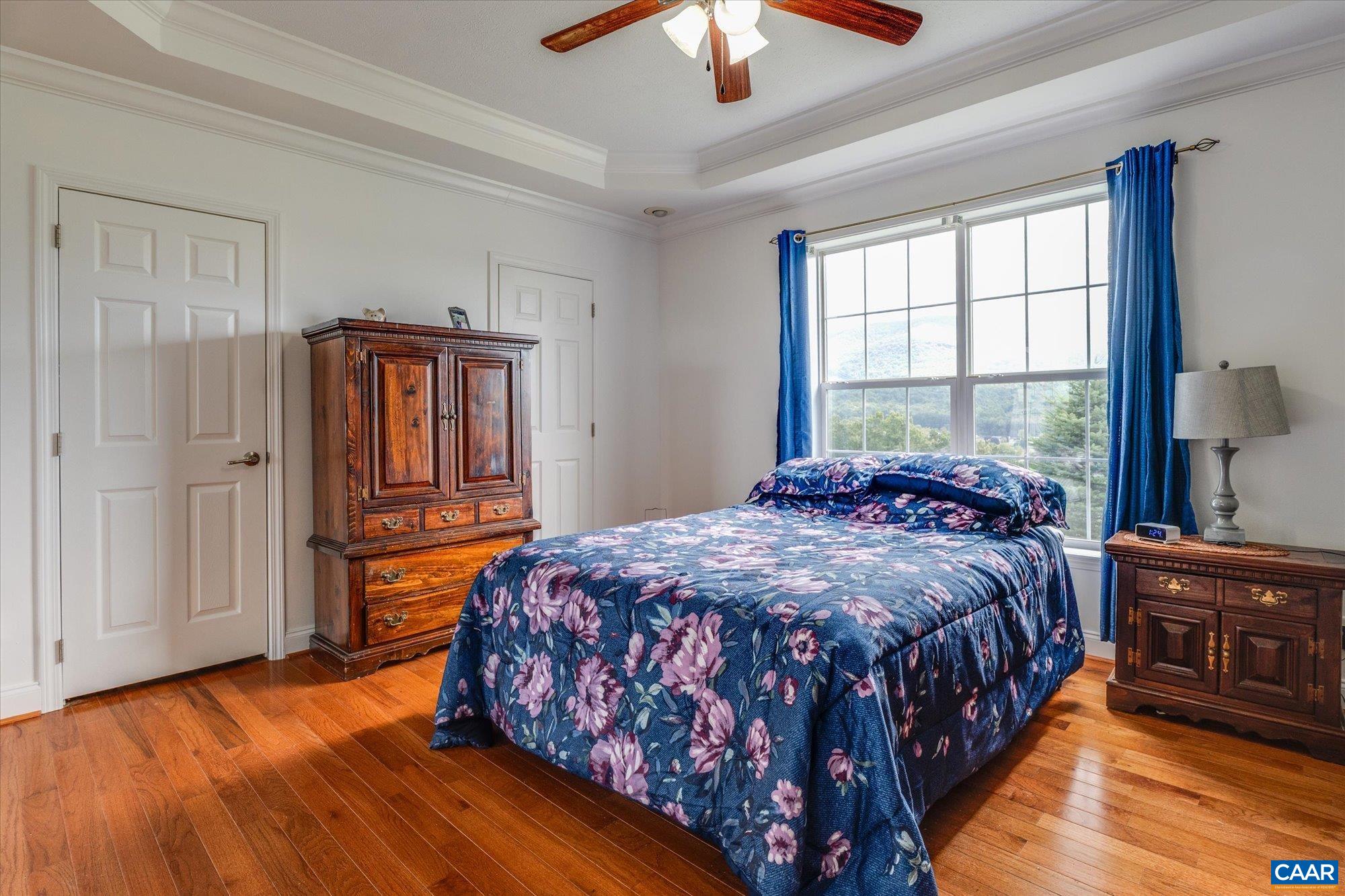 3225 Lynn Hollow Road North Tazewell, VA 24630 - Photo 39 of 62 a bedroom with a bed and a chandelier