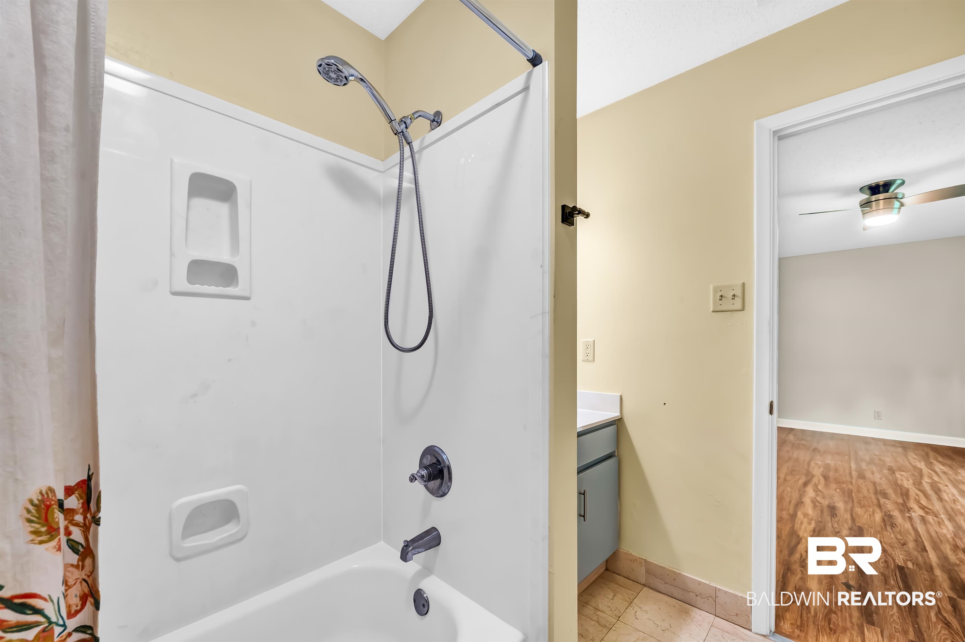 28 Caisson Trace Spanish Fort, AL 36527 - Photo 28 of 51 Bathroom featuring baseboards, shower / bathtub combination with curtain, and vanity