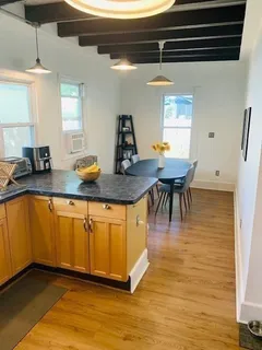 a view of a kitchen and dining area