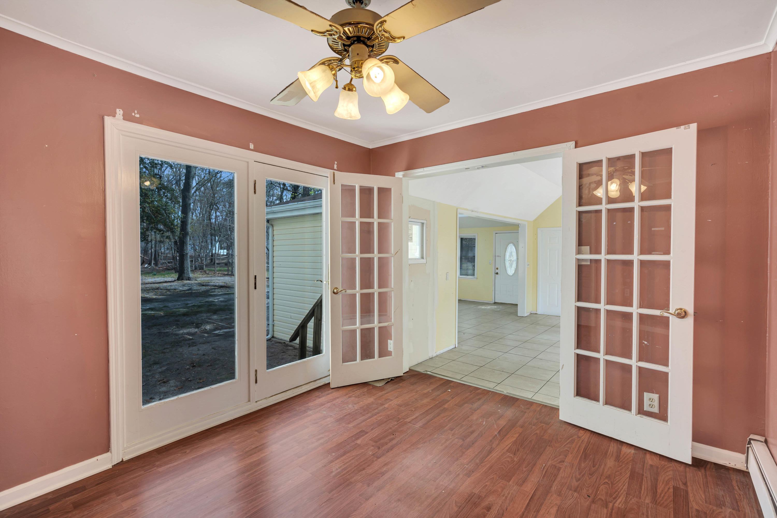 15 North Boston Road Jackson, NJ 08527 - Photo 16 of 49 an empty room with wooden floor and door