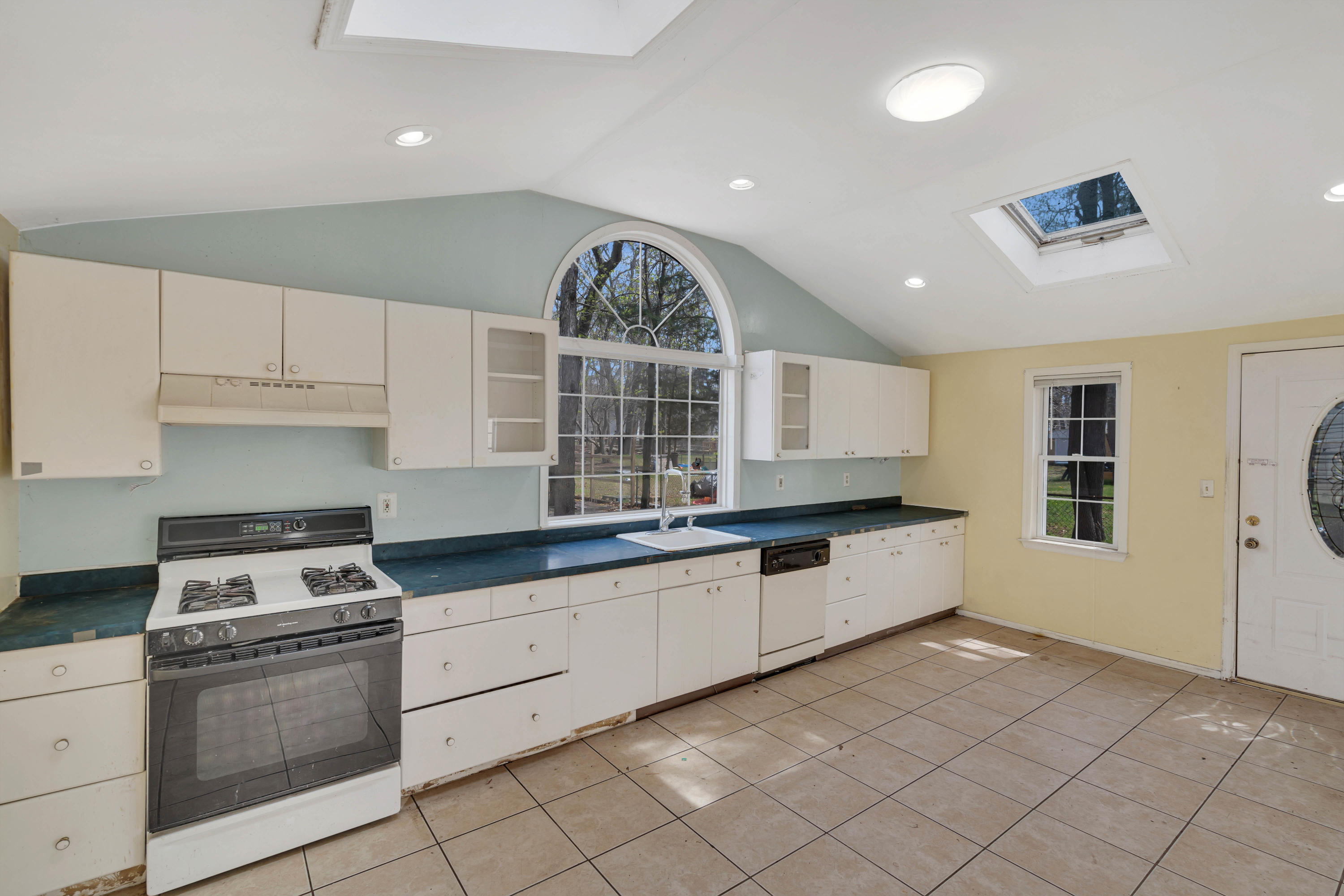 15 North Boston Road Jackson, NJ 08527 - Photo 21 of 49 a large white kitchen with granite countertop a stove a sink and a refrigerator
