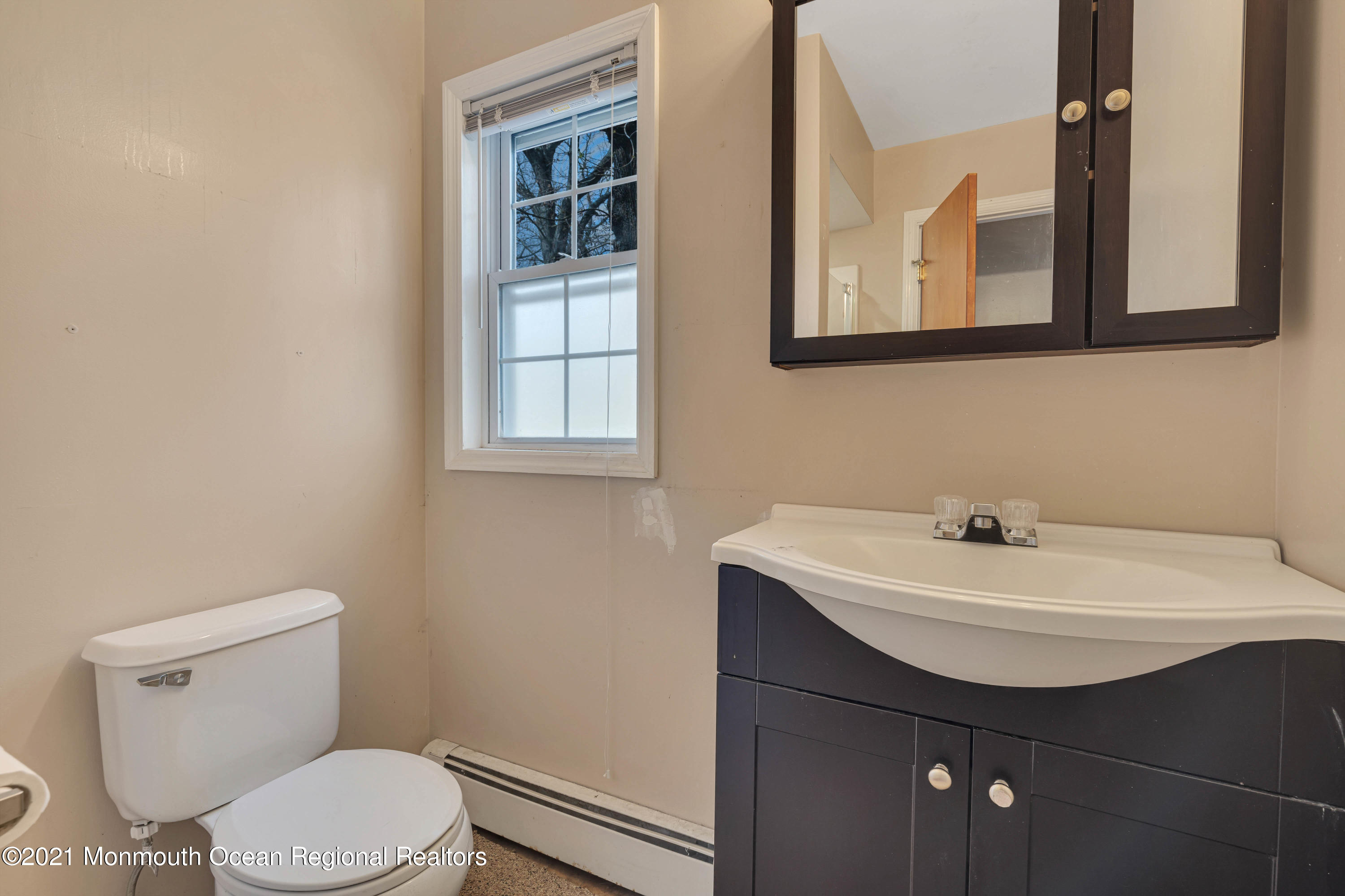 15 North Boston Road Jackson, NJ 08527 - Photo 31 of 49 a bathroom with a sink a toilet and a mirror