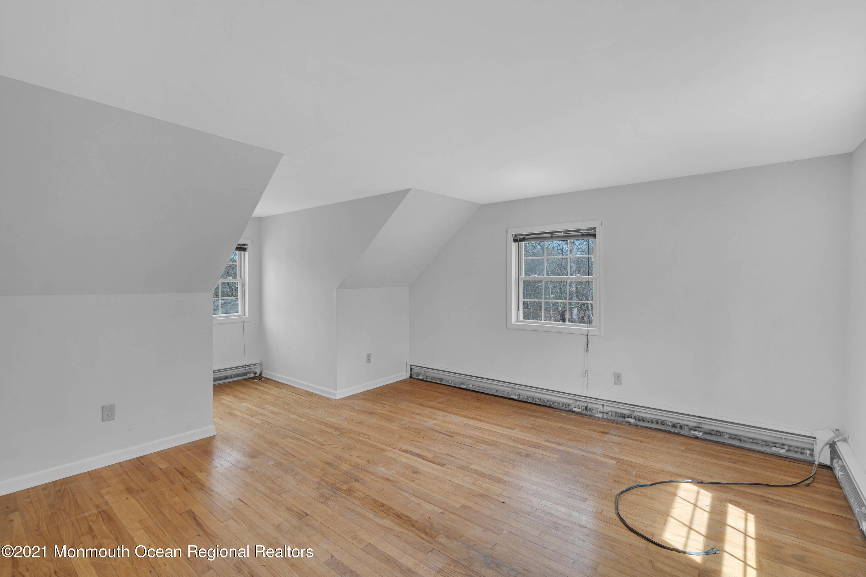 15 North Boston Road Jackson, NJ 08527 - Photo 36 of 49 an empty room with wooden floor and windows
