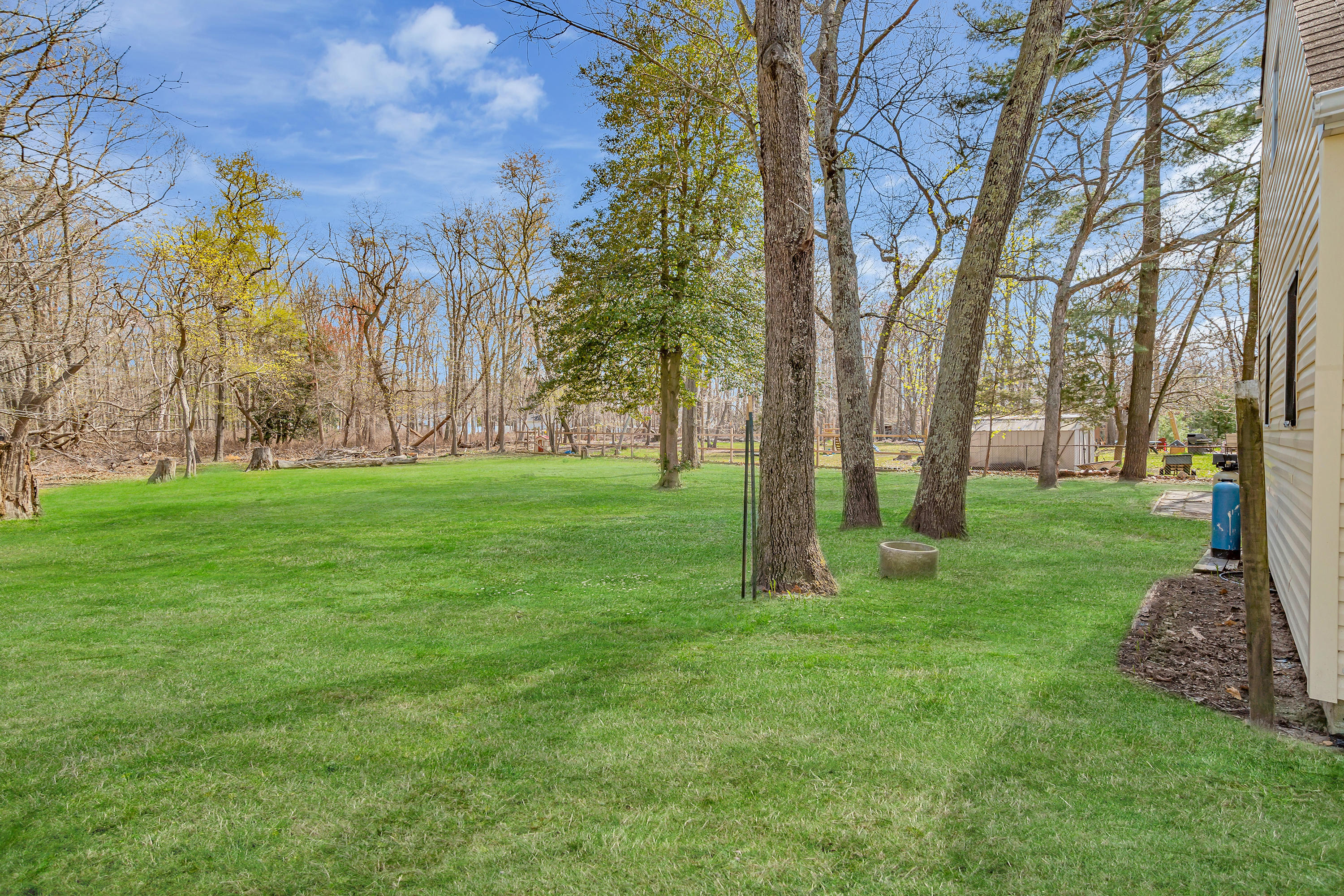 15 North Boston Road Jackson, NJ 08527 - Photo 46 of 49 a view of a backyard with large trees