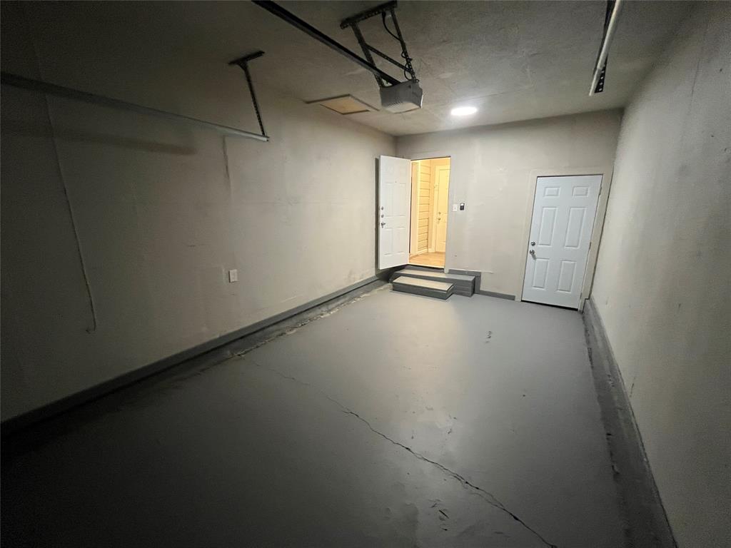 1125 Rancho Drive Mesquite, TX 75149 - Photo 20 of 23 Garage featuring a garage door opener