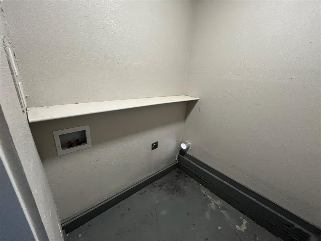 1125 Rancho Drive Mesquite, TX 75149 - Photo 21 of 23 Laundry area with hookup for an electric dryer, a textured wall, unfinished concrete floors, and washer hookup