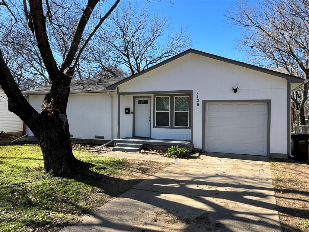 1125 Rancho Drive Mesquite, TX 75149 - Photo 3 of 23 Ranch-style house featuring concrete driveway and an attached garage