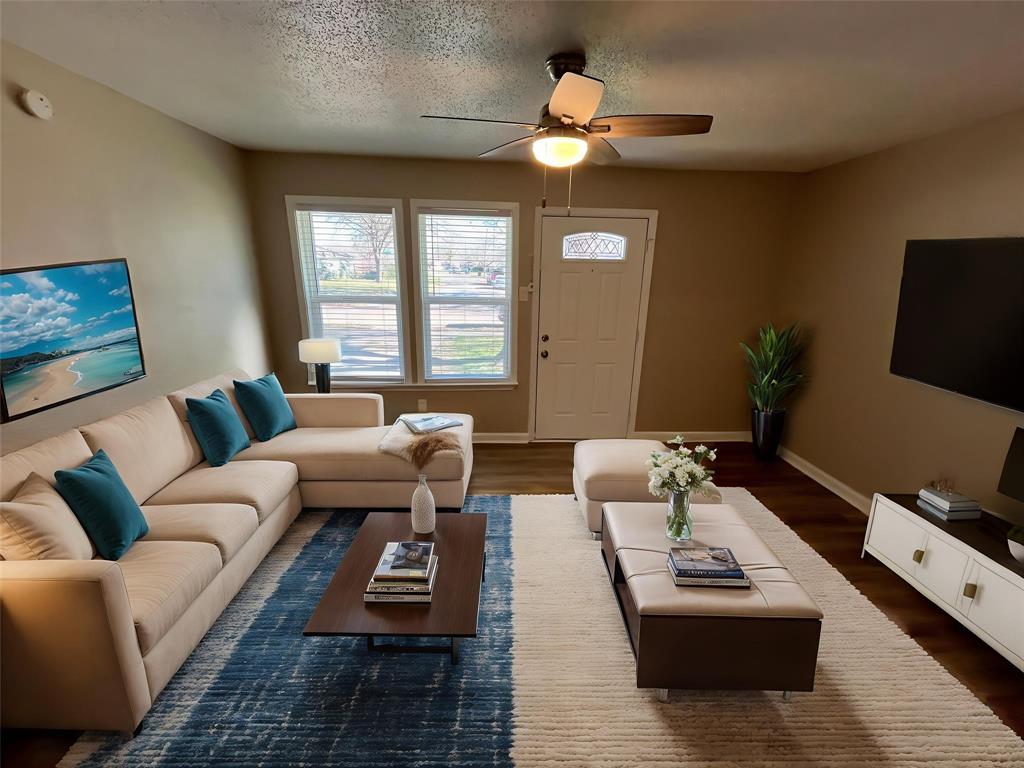1125 Rancho Drive Mesquite, TX 75149 - Photo 6 of 23 Living room with a textured ceiling, a ceiling fan, and dark wood-type flooring