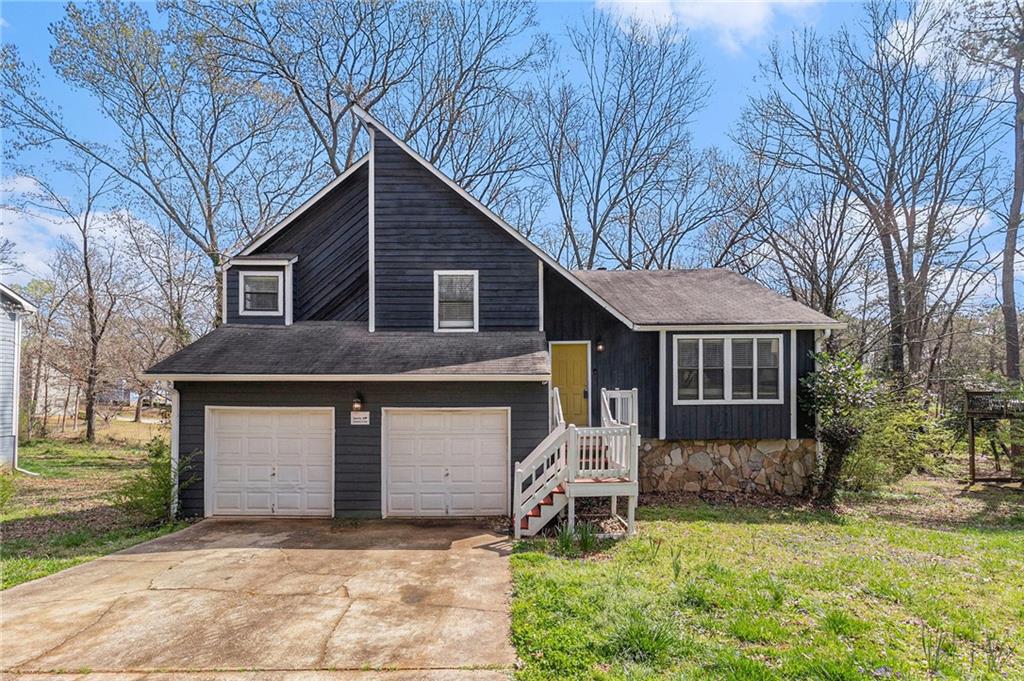 3524 Tarragon Drive Decatur, GA 30034 - Photo 1 of 1 a front view of a house with a yard and garage