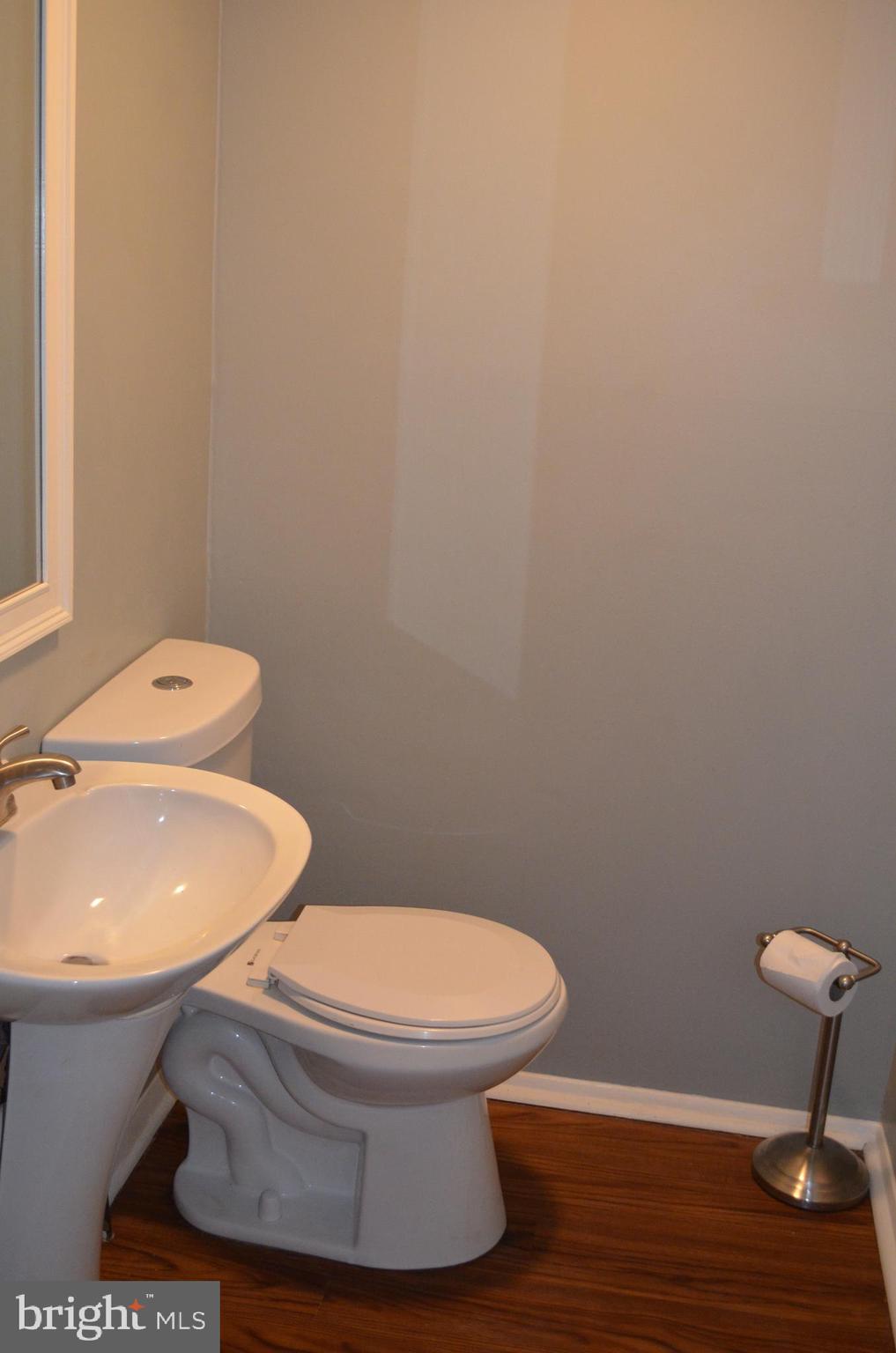 1739 Northridge Lane Frederick, MD 21702 - Photo 11 of 45 a white toilet sitting next to a bathroom sink