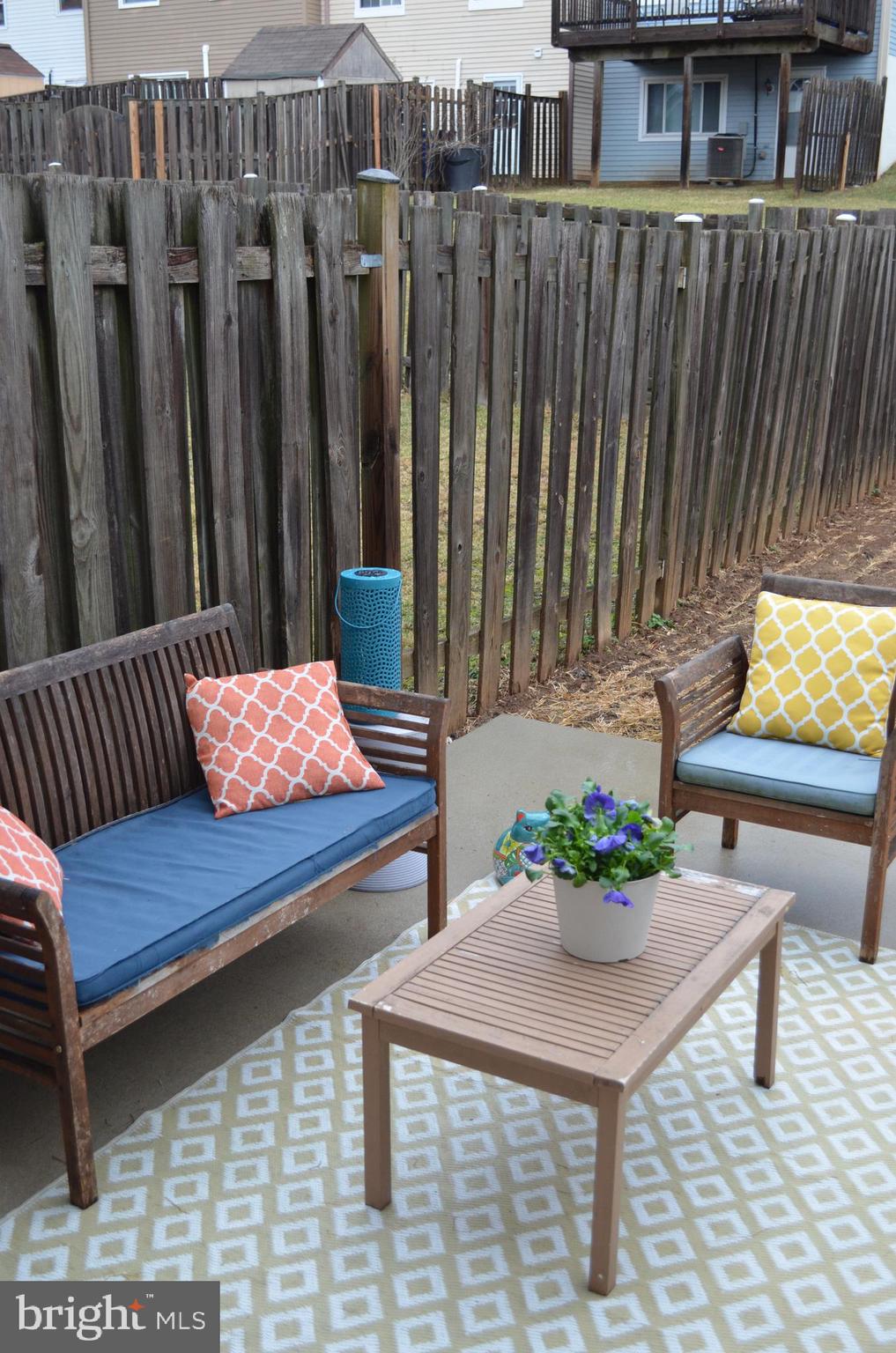 1739 Northridge Lane Frederick, MD 21702 - Photo 14 of 45 a wooden bench sitting in front of a building