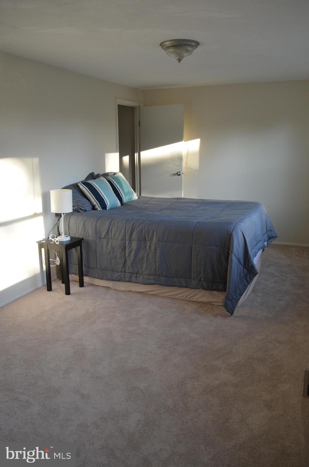 1739 Northridge Lane Frederick, MD 21702 - Photo 18 of 45 a spacious bedroom with a bed and window