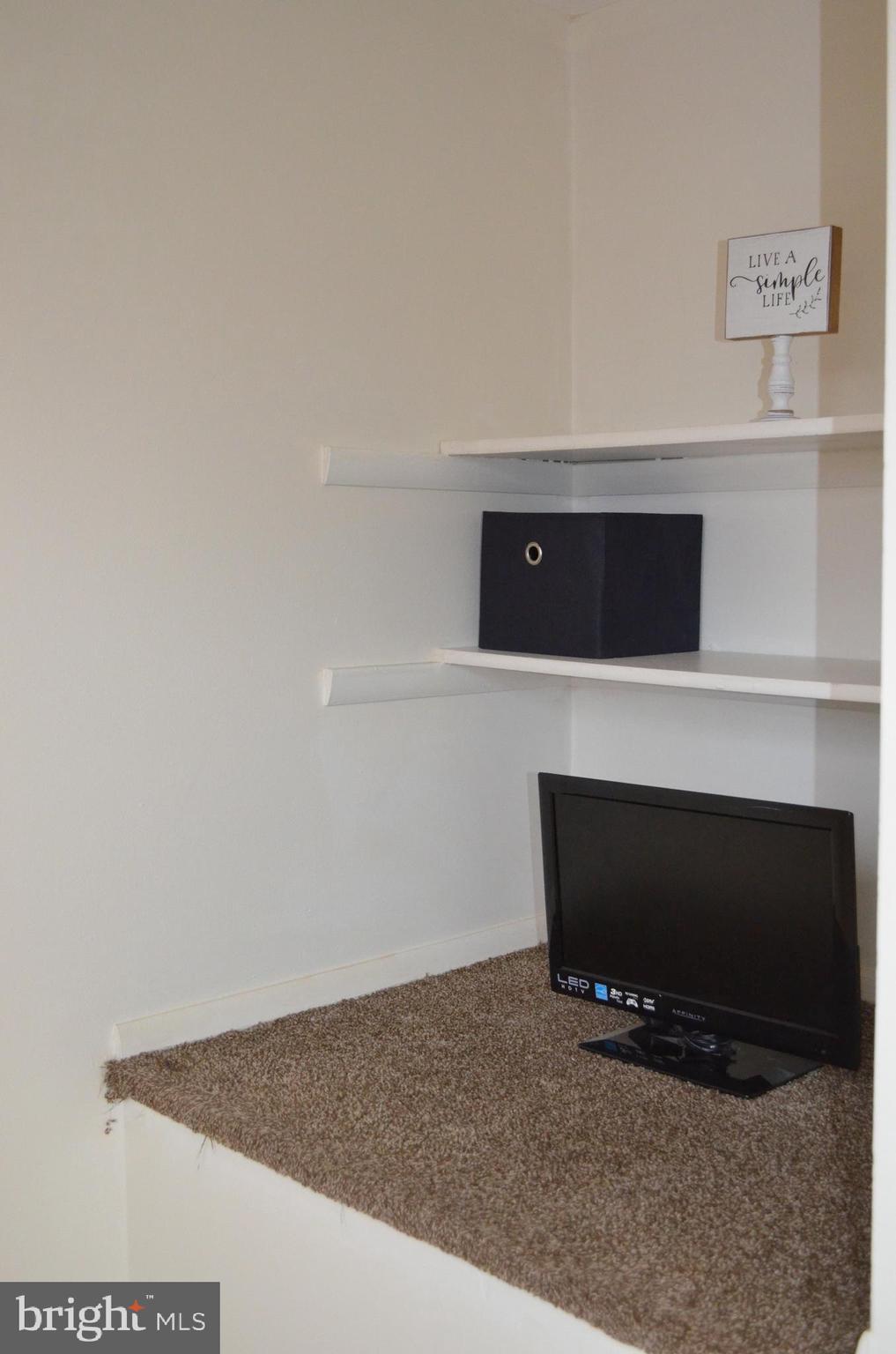 1739 Northridge Lane Frederick, MD 21702 - Photo 21 of 45 a living room with a flat screen tv and a fireplace