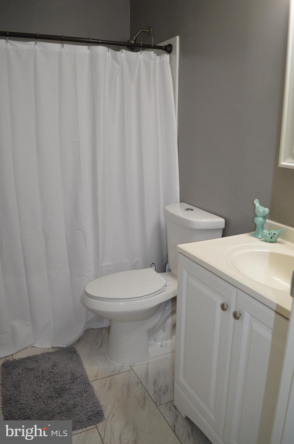 1739 Northridge Lane Frederick, MD 21702 - Photo 25 of 45 a bathroom with a toilet a sink and curtain