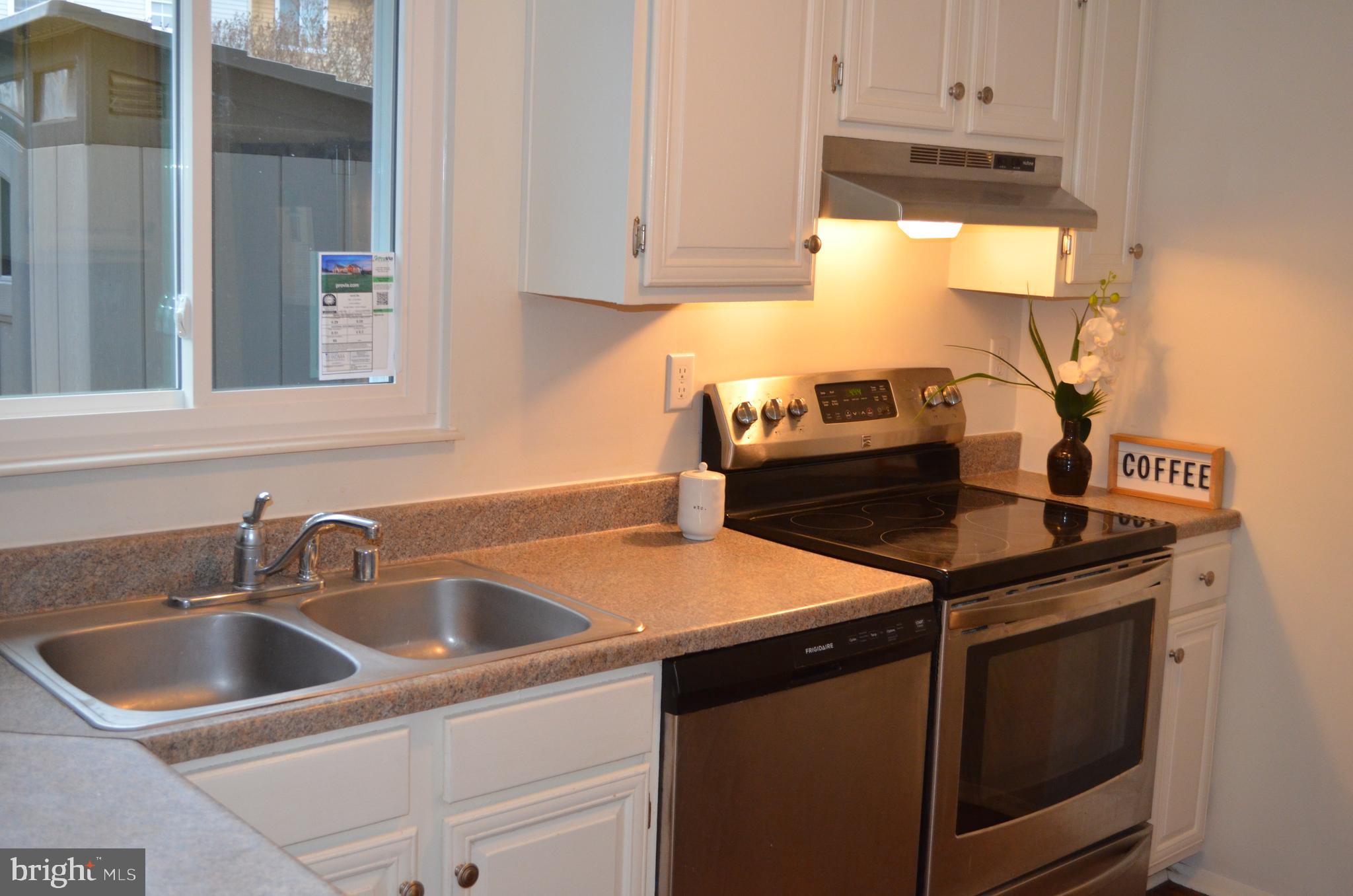1739 Northridge Lane Frederick, MD 21702 - Photo 8 of 45 a kitchen with stainless steel appliances granite countertop a sink stove and cabinets
