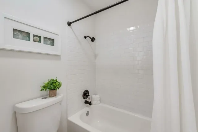 a bathroom with a shower curtain
