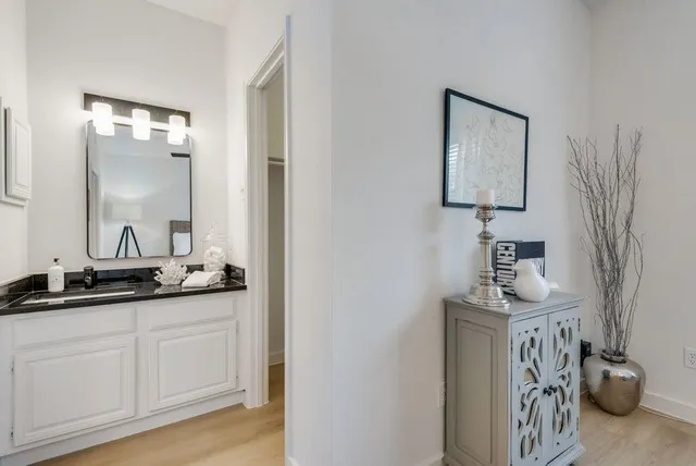 a bathroom with a sink and a mirror