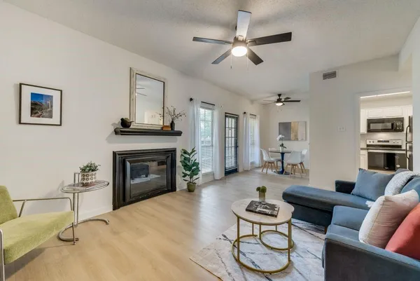 a living room with furniture and a fireplace