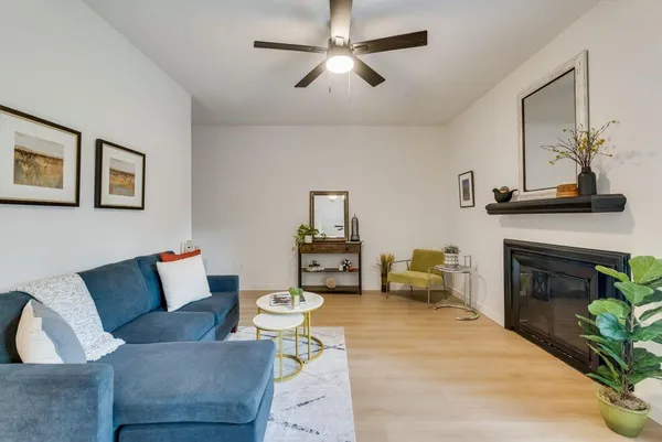 a living room with furniture and a fireplace