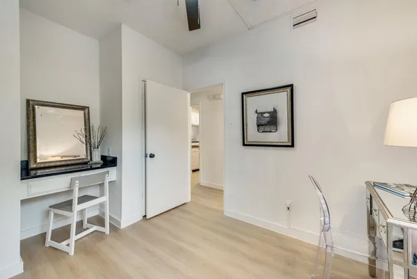 a view of a hallway with workspace
