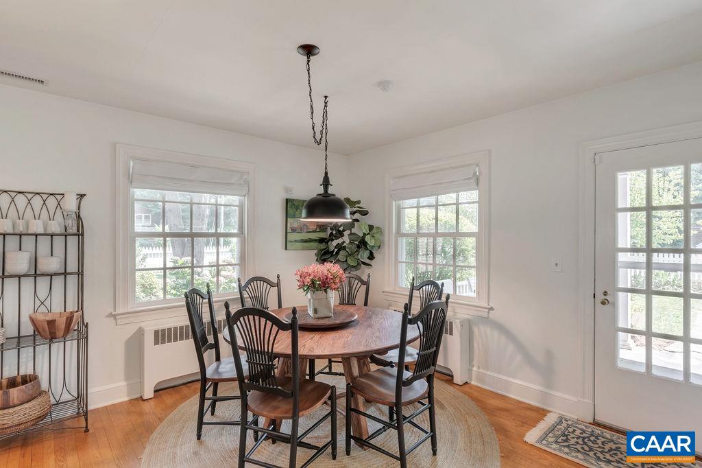 1500 Rugby Avenue Charlottesville, VA 22903 - Photo 18 of 50 a view of a dining room with furniture window and wooden floor