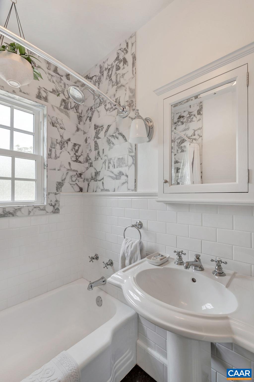 1500 Rugby Avenue Charlottesville, VA 22903 - Photo 22 of 50 a bathroom with a bathtub and a sink