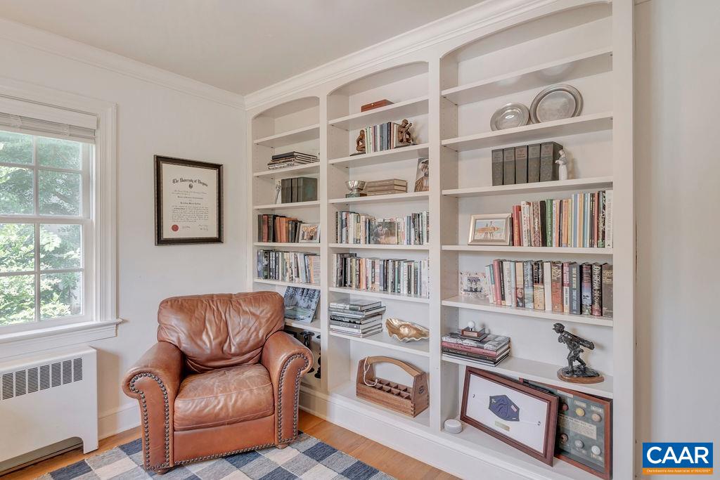 1500 Rugby Avenue Charlottesville, VA 22903 - Photo 24 of 50 a living room with furniture and a book shelf