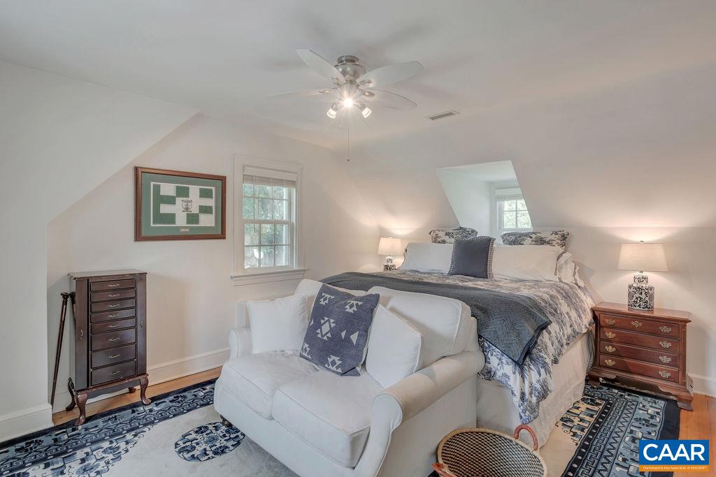 1500 Rugby Avenue Charlottesville, VA 22903 - Photo 25 of 50 a spacious bedroom with a bed and wooden floor