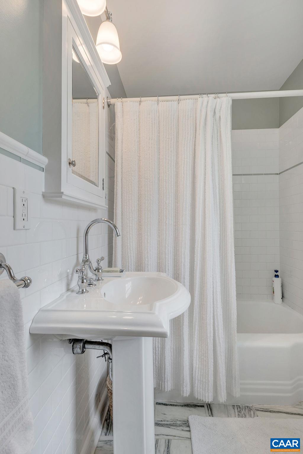 1500 Rugby Avenue Charlottesville, VA 22903 - Photo 27 of 50 a bathroom with a sink and a mirror