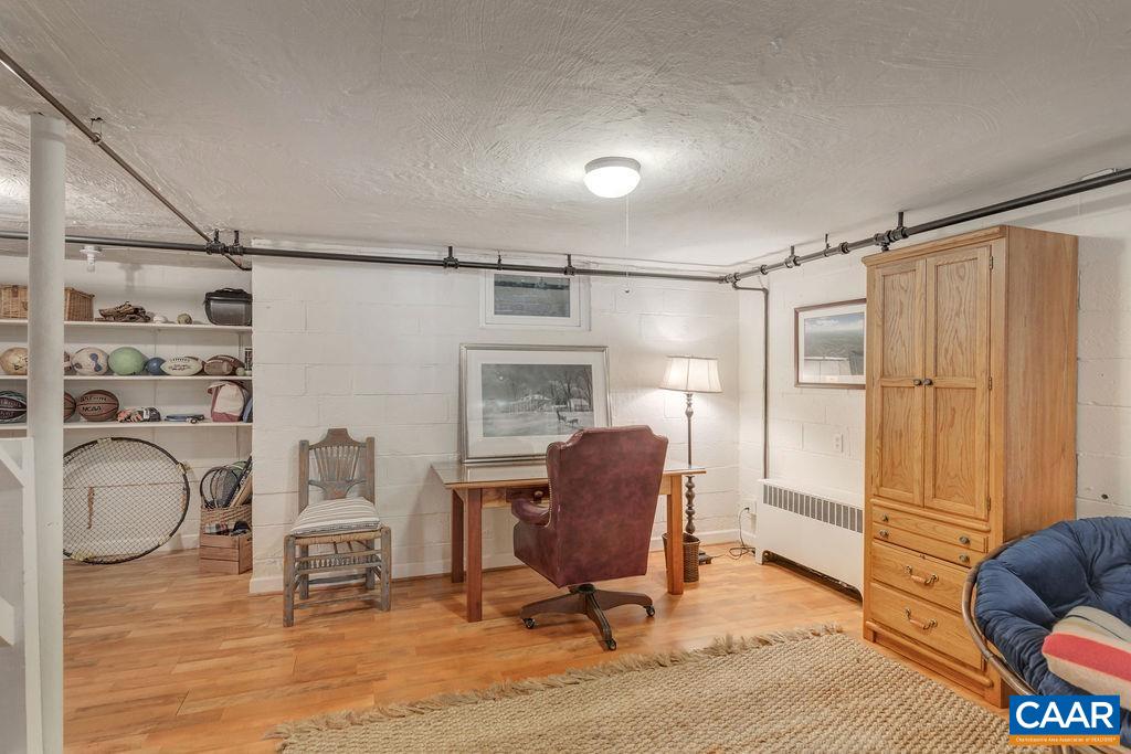 1500 Rugby Avenue Charlottesville, VA 22903 - Photo 31 of 50 a view of a workspace with furniture and a window