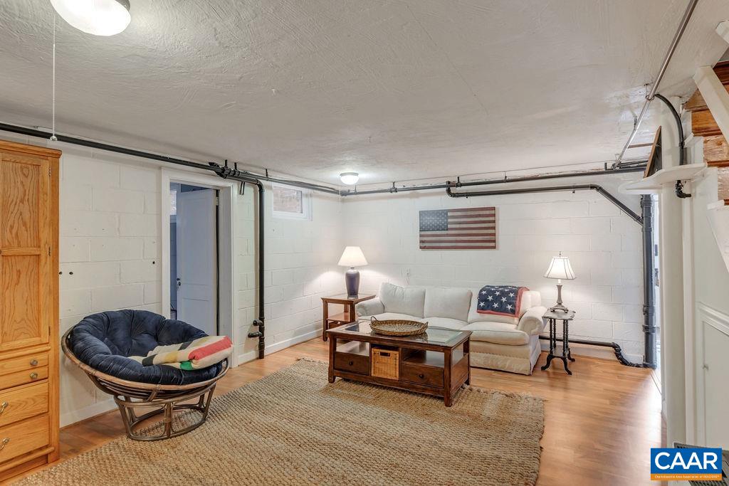 1500 Rugby Avenue Charlottesville, VA 22903 - Photo 32 of 50 a living room with furniture and a window