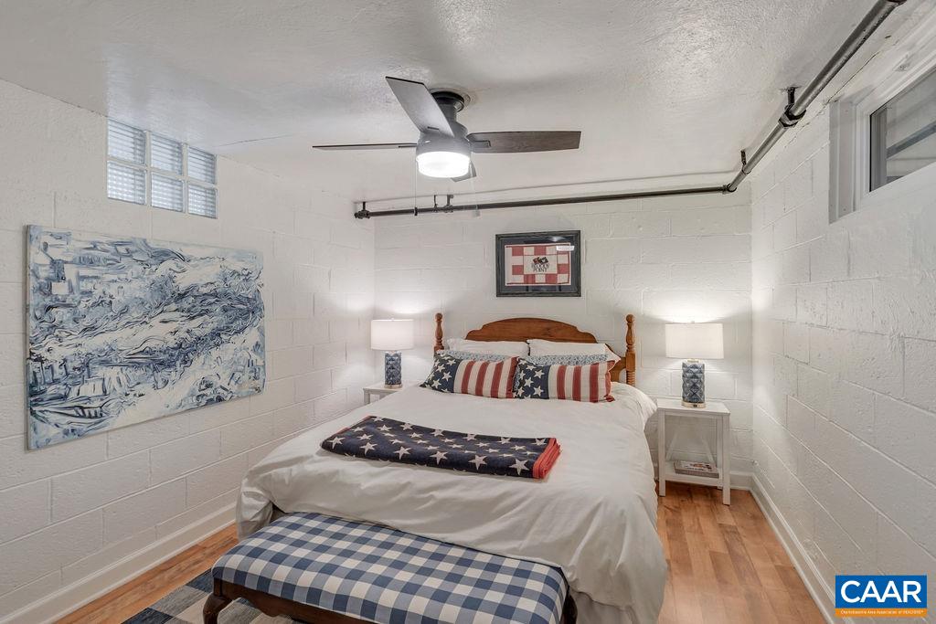 1500 Rugby Avenue Charlottesville, VA 22903 - Photo 33 of 50 a bedroom with a bed and a lamp