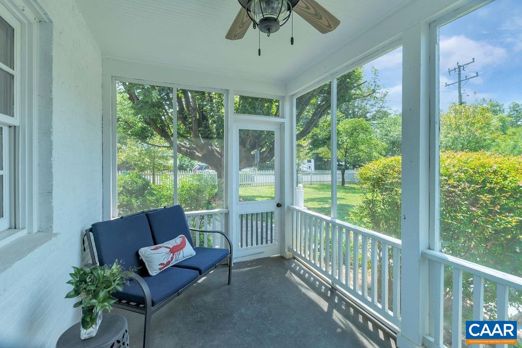 1500 Rugby Avenue Charlottesville, VA 22903 - Photo 45 of 50 a living room with furniture and a floor to ceiling window